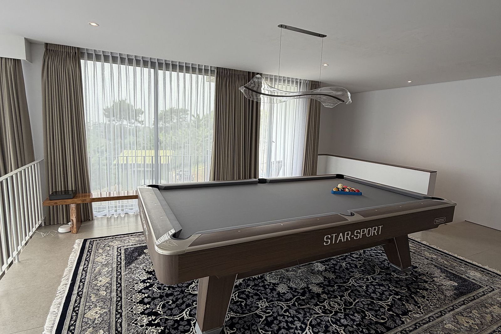 The billiard room, its windows facing the valley