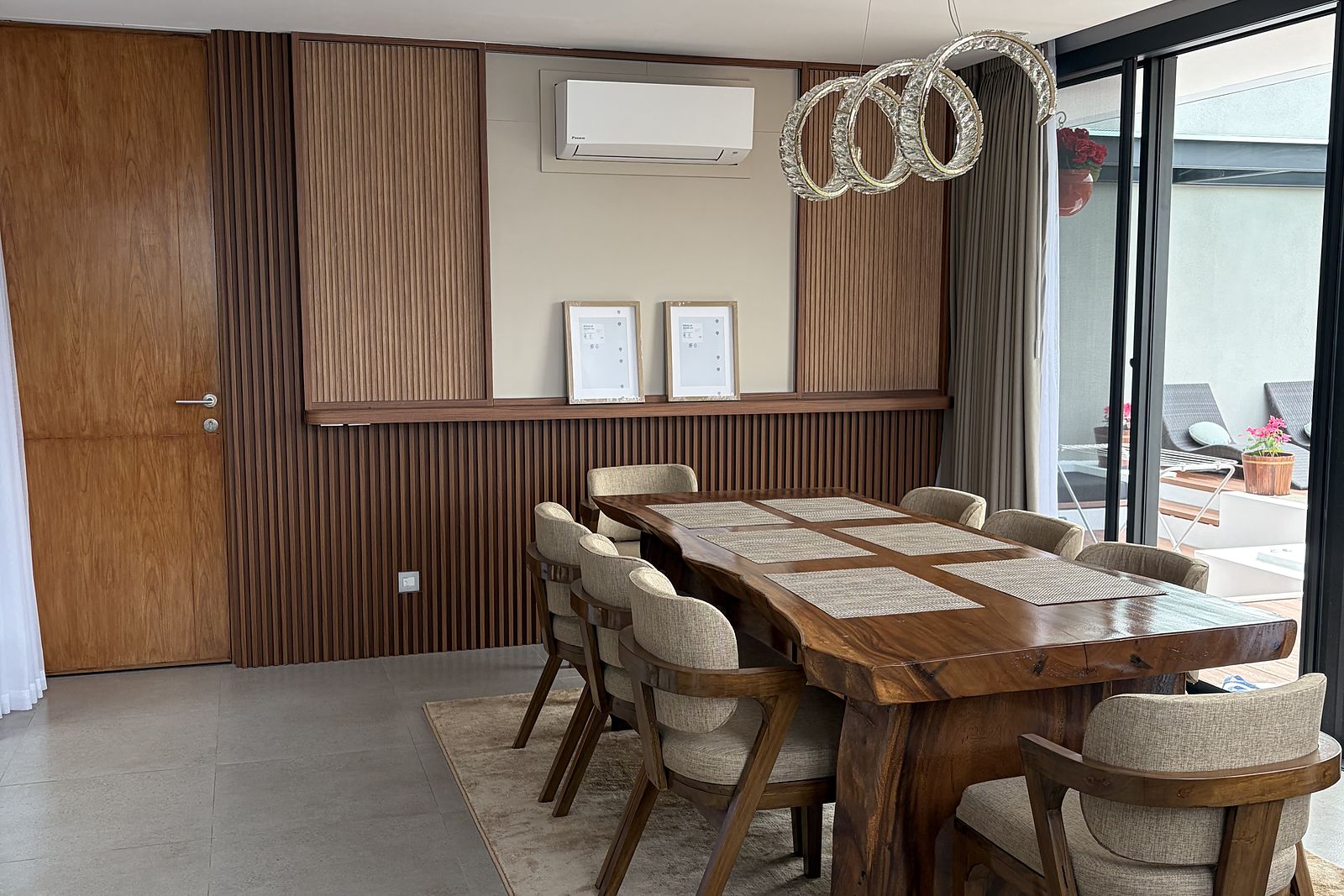 The dining room, a live-edge timber table seating eight